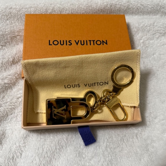 Louis Vuitton lock and key bag charm. Includes box and dust bag. - Picture 3 of 3